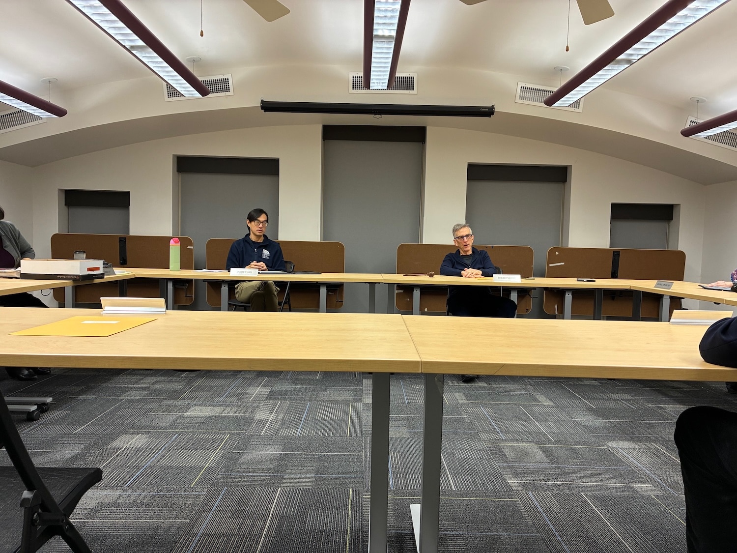 Library Executive Director Andrew Kim and Board President Roger Parfitt are shown above at a special meeting held Dec. 4. Vice President Jim Fiffer, Secretary Nan Weiss-Ham and trustees Linda Lin and Michael Pope also attended the meeting. Board Treasurer Robert Kimble was absent from the in-person meeting.